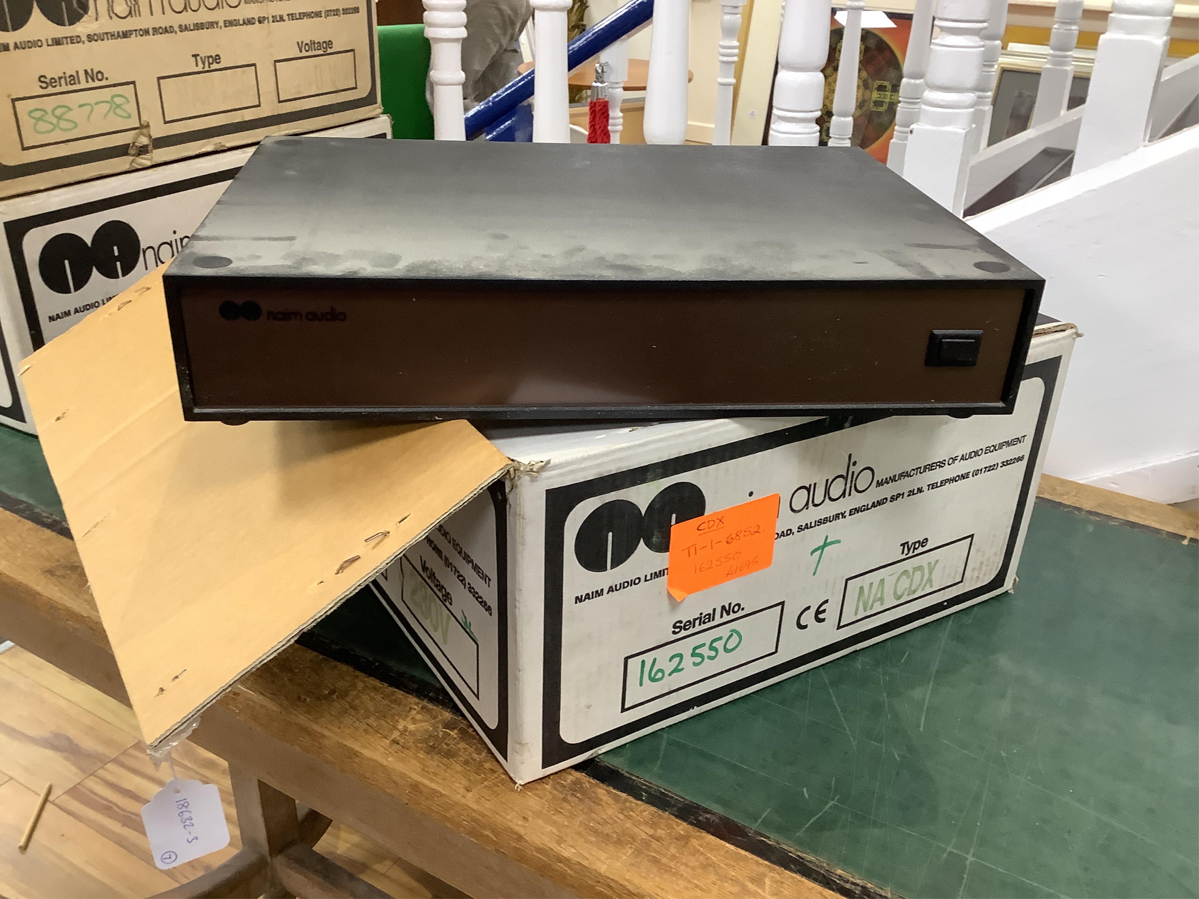 Seven Naim Audio hi-fi separates in original card boxes; a Niam HiCap DR power supply unit, serial number 70557, a Niam NAP 250 power amplifier, serial number 88778, a Niam NAT 02 FM Tuner, serial number 75339, a Niam NA